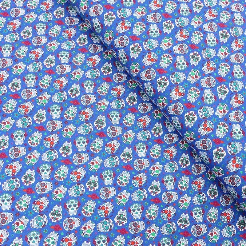 Tissu Coton Imprimé Tête de Mort Bleu