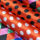 Tissu Satin Carnaval Pois Blanc Fond rouge