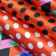 Tissu Satin Carnaval Pois Noir Fond Rouge